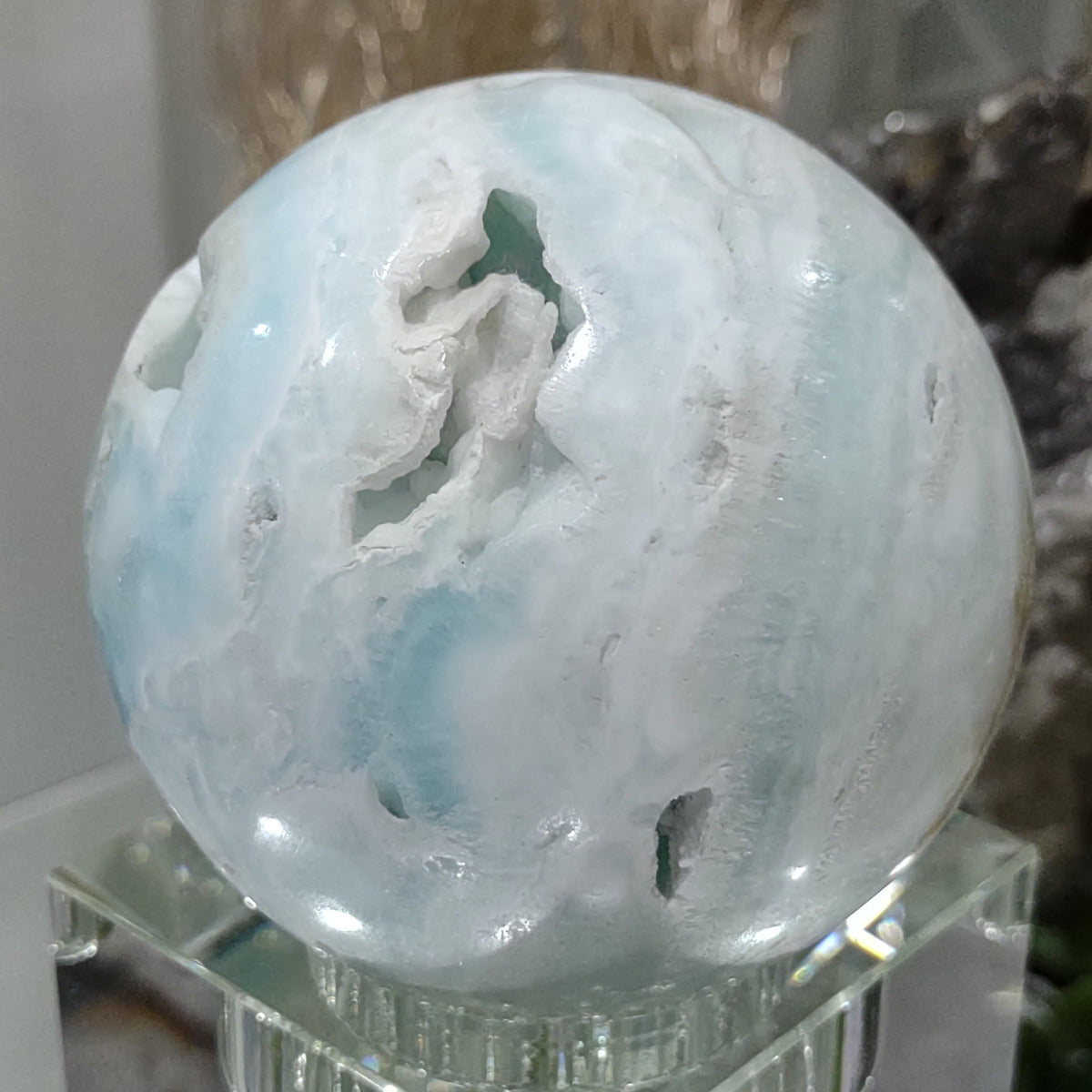 Caribbean Blue Calcite Sphere with deep stunning cavities (7.1cm) - 457g