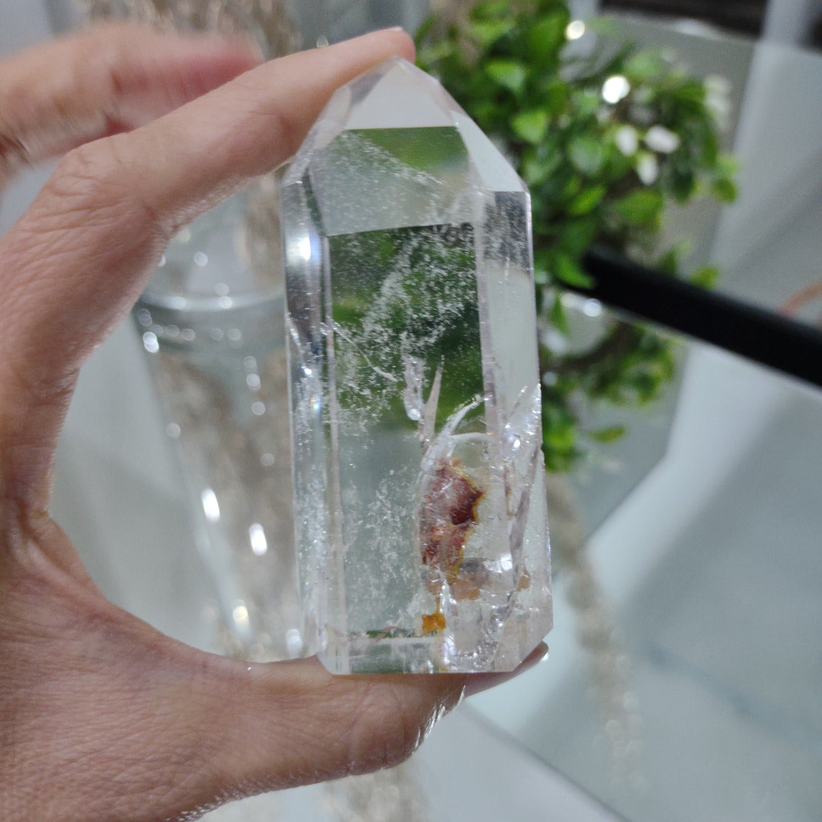 Clear Quartz Generator with hematite inclusions (8.1cm) - 125g