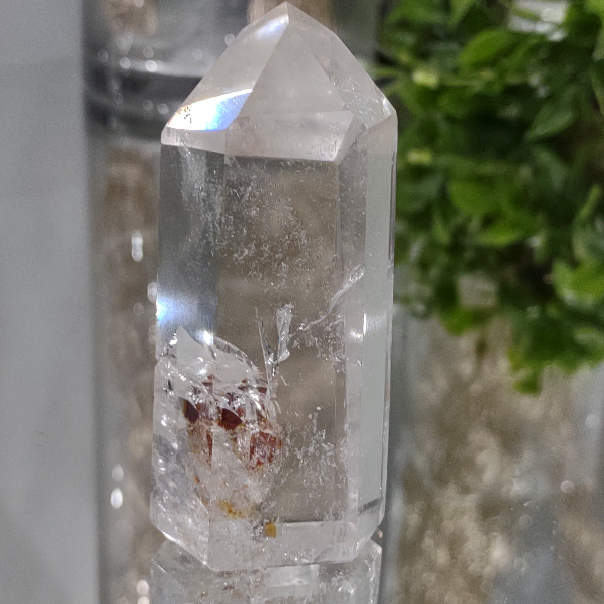 Clear Quartz Generator with hematite inclusions (8.1cm) - 125g